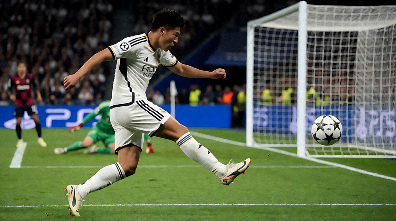 欧冠淘汰赛夜间比赛中球员射门瞬间